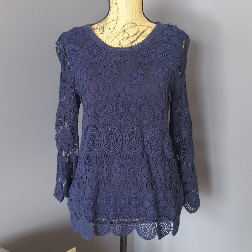 Long sleeve crochet top with button back.